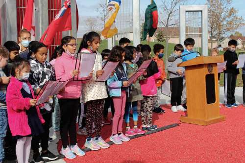 Photo by Kelsey James
Students from Bairdmore Elementary School presented a song at the unveiling of the Mother Tongue Plaza, located in Kirkbridge Park, on Oct. 12.