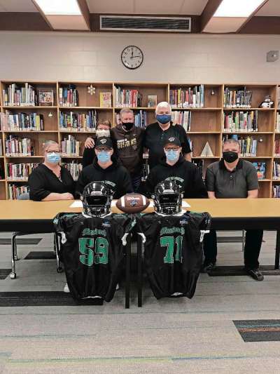 Sheldon Birnie
Drew and Jordin Boucher, Grade 12 students at Murdoch MacKay Collegiate, committed to play with the University of Manitoba Bisons on Dec. 15. Pictured, back row from left: Lenora Boucher, Bisons coach Brian Dobie, Gilbert Boucher. Front row: Tammy, Drew, Jordin, and Greg Boucher. (SHELDON BIRNIE/CANSTAR/THE HERALD)