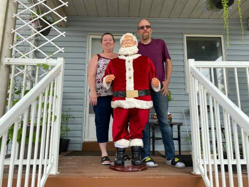 Nicole and Richard Holm are the caretakers of Santa on Nairn Ave. The iconic East Elmwood statue, located at 491 Nairn Ave., was recently vandalized beyond repair. However, a grassroots GoFundMe campaign has replaced the statue and covered costs of installing security cameras to keep an eye on Saint Nick.