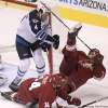 Joe Bryksa / Winnipeg Free Press
Winnipeg Jets' Zach Bogosian clears Phoenix Coyotes' Boyd Gordon from the front of the net at Jobing.com Arena in Glendale, Ariz., Saturday.
