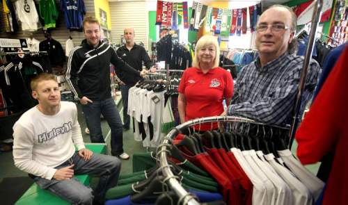 Phil Hossack / Winnipeg Free Press
Christine and Cavan O'Connor and their three sons, Dylan (from left), Brad and Adam, in Winnipeg's iconic soccer store, The Sweat Shack.  The family has run the store for 32 years.