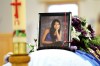 Ruth Bonneville / The Winnipeg Free Press
Tina Fontaine's photographs sit on top of her casket surrounded by  flowers and items in the colour purple, her favourite colour, in front of Roman Catholic Church at Sagkeeng First Nation for her funeral.