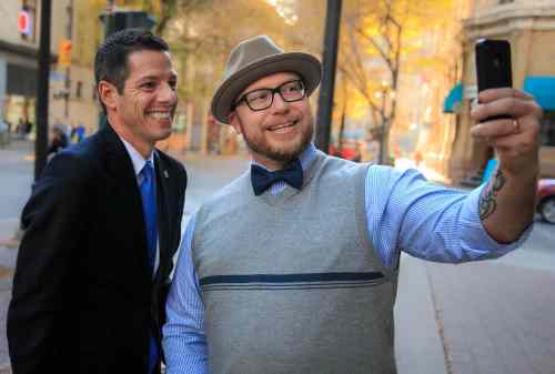 Melissa Tait / Winnipeg Free Press
Mayor-elect Brian Bowman poses for a selfie with Luke Nolan Thursday morning in the Exchange District.