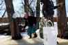 Tim Smith / Brandon Sun files
Leane Wurtz laughs while climbing under a fence during the maple sap collection at Deerboine Hutterite Colony north of Alexander,