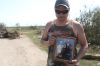 Melissa Verge/The Brandon Sun
Kelly Brown holds a photo of himself with his grandparents outside of his grandfathers former home. Seventy-seven-year-old Jack Furrie (left) was killed in a tornado on Friday evening.