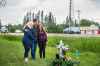 MIKAELA MACKENZIE / WINNIPEG FREE PRESS
Brenda (left), John, and Hannah Harris stand by the makeshift memorial at Donald road and highway nine, where Ben Harris was killed in a hit-and-run Friday night.