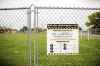 MIKAELA MACKENZIE / WINNIPEG FREE PRESS
The field is fenced off from the concrete play area after the field was found to have more than 1,000 mg/g lead levels in some parts at Weston School.