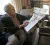 Len Van Roon, D-Day veteran, is photographed in his Charleswood home Wednesday, May 29, 2019 as he looks at a newspaper which described the battle. (John Woods / Winnipeg Free Press)