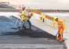 SASHA SEFTER / WINNIPEG FREE PRESS
Construction crews put down layer of asphalt on the roadway through the Waverly underpass on Wednesday afternoon.