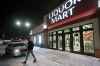 Customers are turned away as police investigate a robbery at a Liquor Mart on Keewatin in Winnipeg, Wednesday, November 20, 2019. An employee was injured in the robbery. (john Woods / Winnipeg Free Press)