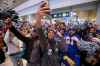 JOHN WOODS / WINNIPEG FREE PRESS
Kenny Lawler takes video as Winnipeg Blue Bomber fans celebrate the team back at the Winnipeg airport after winning the 107th Grey Cup over the Hamilton Tiger Cats Winnipeg Monday.