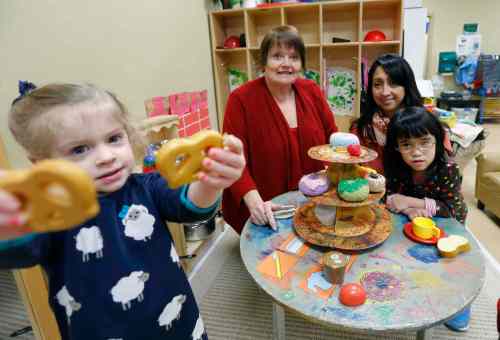 WAYNE GLOWACKI / WINNIPEG FREE PRESS
Sunny Mountain Day Care Centre director Debra Page (second from left) and manager Claire Ferrer -- with two of their charges, Zoey (left) and Mary -- are feeling the crunch of rising rent.