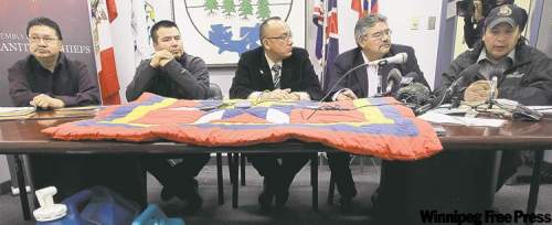 JOE.BRYKSA@FREEPRESS.MB.CA
From left, Wasagamack Chief Jerry Knott, Garden Hill Chief Dino Flett, AMC Grand Chief Ron Evans, St. Theresa Point Chief David McDougall and Red Sucker Lake Chief Larry Knott tell media Monday of the need for an all-weather road from Norway House to First Nations in the Island Lake area.