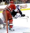 rick havner / the associated press
Carolina Hurricanes' Anthony Stewart upends Jets' Brett Festerling in the second period. The Jets' travel schedule might be leaving the team feeling a little flattened itself, but they aren't complaining.