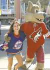 FAR LEFT: A Winnipeg Jets fan has fun with Howler, the Phoenix Coyotes mascot, outside the Jobing.com Arena.