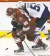JOE BRYKSA / WINNIPEG FREE PRESSJets forward Mark Scheifele (rear) tries to steal the puck from Coyotes� Mikkel Boedker in the third period Saturday in Phoenix.