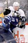 CP
John Woods / the canadian press archivesJets defenceman Johnny Oduya takes out Pittsburgh Penguins forward Pascal Dupuis on Monday night.