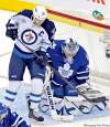 REUTERS
Mike Cassese / reutersLeafs goalie James Reimer makes a save behind Jets forward Andrew Ladd.