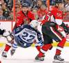 Postmedia Ottawa Citizen
Jean Levac / postmedia news Jets forward Chris Thorburn gets dumped to the ice by Ottawa blue-liner Jared Cowen during the second period at Scotiabank Place Thursday.