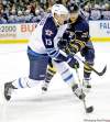 CP
David Duprey / the associated pressWinnipeg�s Kyle Wellwood (left) unloads a shot under pressure from Buffalo�s Ville Leino on Tuesday.