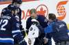 Nikolaj Ehlers (27) is treated by a trainer after being injured on the OT goal.