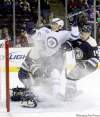 CP
Terry Gilliam / the associated pressJets� Evander Kane is sandwiched by Columbus Blue Jackets� goalie Steve Mason and Grant Clitsome.