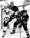 CP
John Woods / the canadian pressWhen not scoring goals, Jets defenceman Mark Stuart (5) can usually be found in his own end of the rink, helping out his goalie.