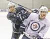 Mike Deal / Winnipeg Free Press
Mike Deal / Winnipeg Free PressJets forwards Tim Stapleton (left) and Jim Slater tangled during Wednesday�s practice at the MTS Iceplex.