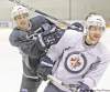Tim Stapleton (left) and Jim Slater didn�t take the easy way out at Wednesday�s practice. The team went at it hard.