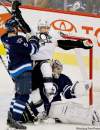 John Woods / the canadian press
The Jets' Mark Stuart (right) pushes the Penguins' Chris Kunitz into Winnipeg goaltender Ondrej Pavelec as Pavelec snags the puck at the MTS Centre Friday.