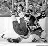 CP
Michael Dwyer / the associated pressBoston�s Brad Marchand (right) went low to upend Vancouver�s Sami Salo on Saturday.