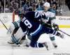 TREVOR HAGAN / WINNIPEG FREE PRESSWinnipeg Jets winger Evander Kane is given a rough ride by San Jose�s Douglas Murray in front of the Sharks� goal during second-period action.