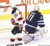 Jets goalie Ondrej Pavelec stones New Jersey�s Patrik Elias on a penalty shot in the third period.