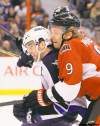 Jean Levac / Postmedia News
Milan Michalek (right) of the Ottawa Senators puts the wraps on Andrew Ladd of the Winnipeg Jets during second-period action Monday in Ottawa.