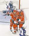 Tribune Media MCT
cris seward / mctThe Carolina Hurricanes� Tim Brent celebrates his game-winning goal with teammates Chad LaRose (59) and Anthony Stewart (13) during the first period against the Winnipeg Jets at the RBC Center in Raleigh, N.C., Monday.