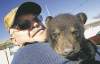 MIKE DEAL / WINNIPEG FREE PRESS
Rene Dubois of St. Malo  with bear cub.