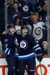 John Woods / The Canadian Press
Winnipeg Jets Adam Lowry (left) and Jacob Trouba celebrate Lowry&rsquo;s goal against the Los Angeles Kings Thursday.