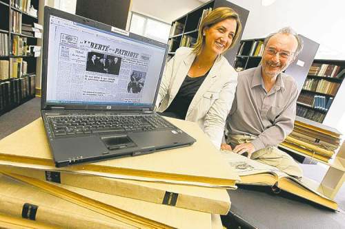 JOHN WOODS / WINNIPEG FREE PRESS
La Liberté s Sophie Gaulin and the Sociiété historique de Saint-Boniface's Gilles Lesage show the archive.