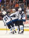 KELVIN KUO / ASSOCIATED PRESS FILES
Winnipeg Jets right wing Blake Wheeler, right, celebrates his overtime goal with center Mark Scheifele, centre, and right wing Nikolaj Ehlers in overtime against the Anaheim Ducks Tuesday.