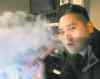 JOE BRYKSA / WINNIPEG FREE PRESS
Jordan Vedoya said demand prompted him to open Fat Panda Vape Shop early. The store has easy chairs, a wide-screen TV and coffee for customers.