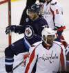 Trevor Hagan / The Canadian Press
Winnipeg Jets' Evander Kane (9) celebrates after scoring to tie the game against the Washington Capitals during first period NHL action at MTS Centre in Winnipeg Thursday. Joel Ward (42) looks on.