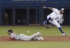 Toronto Blue Jays second baseman Richard Urena can't put the tag on Boston Red Sox Rafael Devers who is safe stealing second base in the first inning of their American League MLB baseball game in Toronto, Monday, May 20, 2019. THE CANADIAN PRESS/Fred Thornhill
