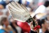 A person holds an eagle feather at the closing ceremony for the National Inquiry into Missing and Murdered Indigenous Women and Girls in Gatineau, Que., on Monday, June 3, 2019. THE CANADIAN PRESS/Adrian Wyld