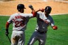 CORRECTS TO A TWO RUN HOME RUN NOT SOLO Boston Red Sox's Xander Bogaerts, right, is congratulated by J.D. Martinez after hitting a two-run home run during the third inning of a baseball game against the Los Angeles Angels Sunday, Sept. 1, 2019, in Anaheim, Calif. (AP Photo/Mark J. Terrill)