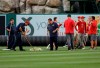 Members of the grounds crew try to clear water from the outfield before a baseball game between the Los Angeles Angels and the Minnesota Twins on Wednesday, May 22, 2019, in Anaheim, Calif. The game was rained out. (AP Photo/Marcio Jose Sanchez)