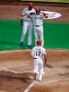 Texas Rangers' Shin-Soo Choo approaches the plate after hitting a three-run home run against the Oakland Athletics that scored Ronald Guzman, left rear, and Jose Trevino during the second inning of a baseball game in Arlington, Texas, Friday, Sept. 13, 2019. (AP Photo/Tony Gutierrez)