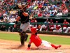 Texas Rangers' Rougned Odor, right, slides home to score ahead of the throw to Chicago White Sox catcher James McCann, left, in he second inning of a baseball game Sunday, June 23, 2019. (AP Photo/ Richard W. Rodriguez)