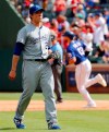 Kansas City Royals' Homer Bailey (21) waits for another ball after giving up a two-run home run to Texas Rangers' Joey Gallo, rear, in the fourth inning of a baseball game in Arlington, Texas, Saturday, June 1, 2019. (AP Photo/Tony Gutierrez)