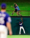 Texas Rangers center fielder Delino DeShields looks up at a home run by Tampa Bay Rays' Austin Meadows during the eighth inning of a baseball game Tuesday, Sept. 10, 2019, in Arlington, Texas. (AP Photo/Richard W. Rodriguez)