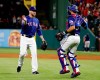 Texas Rangers relief pitcher Shawn Kelley, left, and catcher Isiah Kiner-Falefa, right, celebrate the team's 8-5 win in a baseball game against the Toronto Blue Jays in Arlington, Texas, Saturday, May 4, 2019. (AP Photo/Tony Gutierrez)